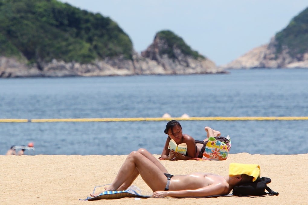Scientists fear large numbers of swimmers at local beaches may cause high concentrations of the sunscreen chemicals to be discharged into waters. Photo: Oliver Tsang