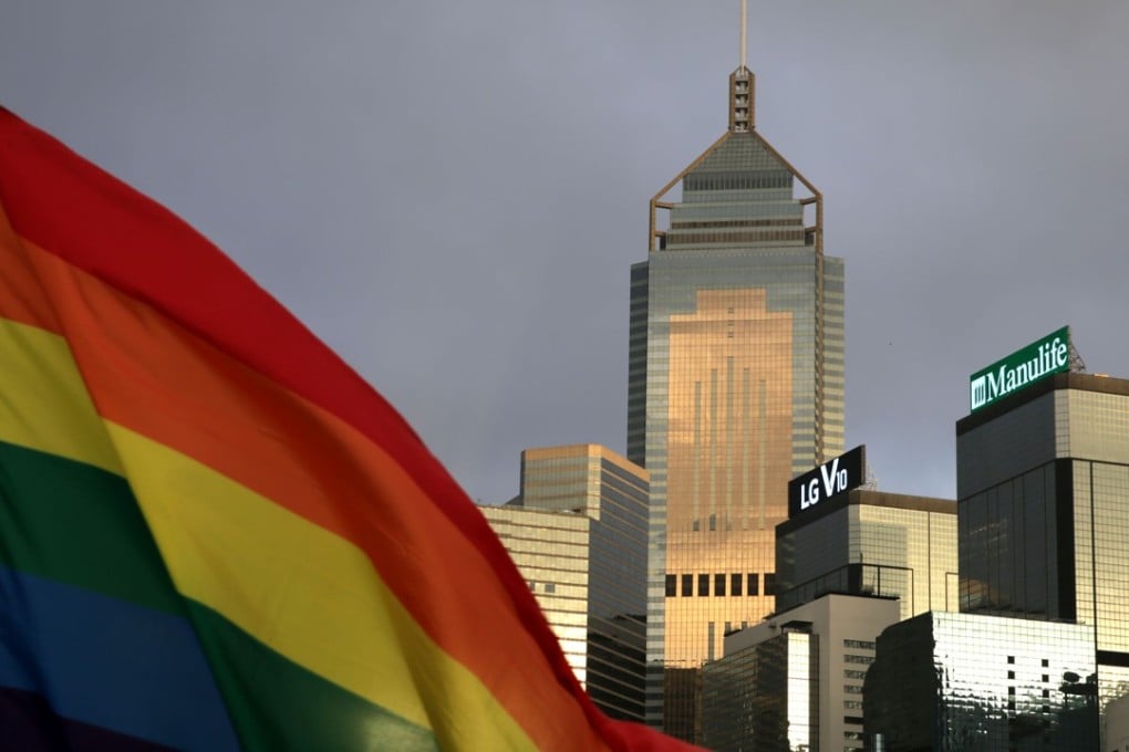 A rainbow flag – one of the symbols of the LGBTQ community – is seen in front of the city sky line in Hong Kong, where the 2022 Gay games will be held. Photo: AFP