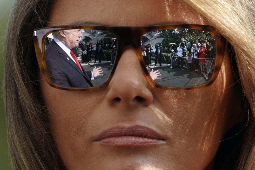 President Donald Trump is reflected in the sunglasses of first lady Melania Trump on the South Lawn of the White House in Washington in this September 10 file photo. Photo: AP