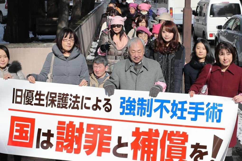 Lawyers and other people supporting a woman seeking damages from the Japanese government over her forced sterilisation under the now-defunct eugenic protection law walk toward the Sendai District Court in Miyagi Prefecture in northeastern Japan on Tuesday. Photo: Kyodo