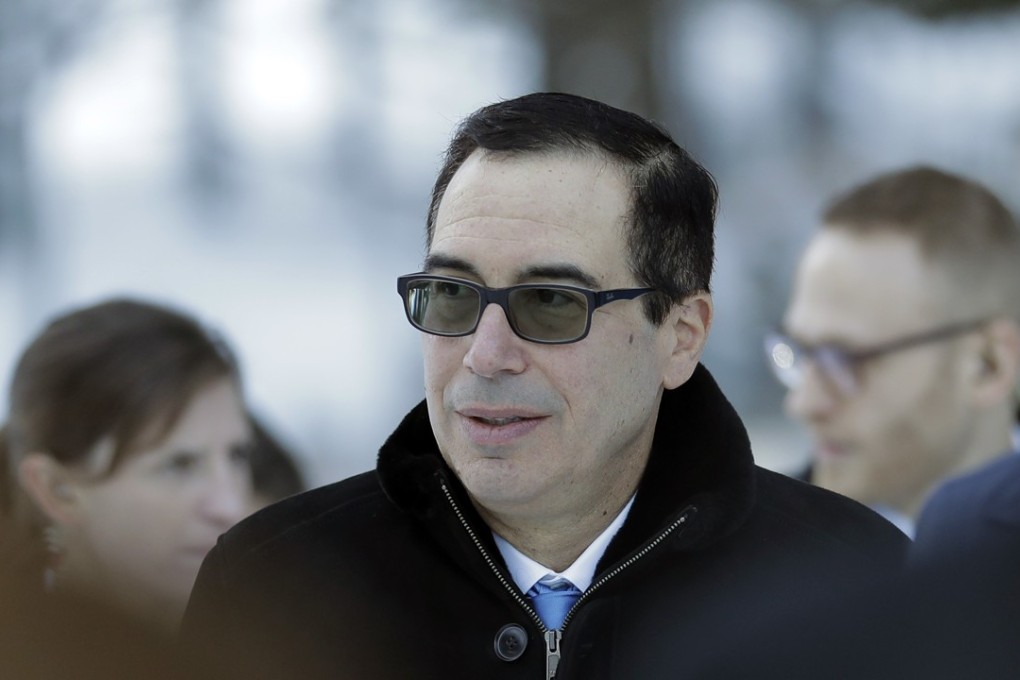 Steven Mnuchin, US Treasury Secretary, walks through the snow during the annual meeting of the World Economic Forum in Davos, Switzerland, on January 24, 2018. Photo: AP