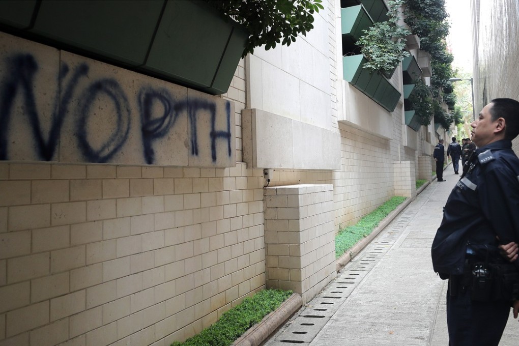 Police follows up on the ‘No Putonghua’ graffiti near the wall of the Baptist University Sports Centre in Kowloon Tong. Photo: Winson Wong