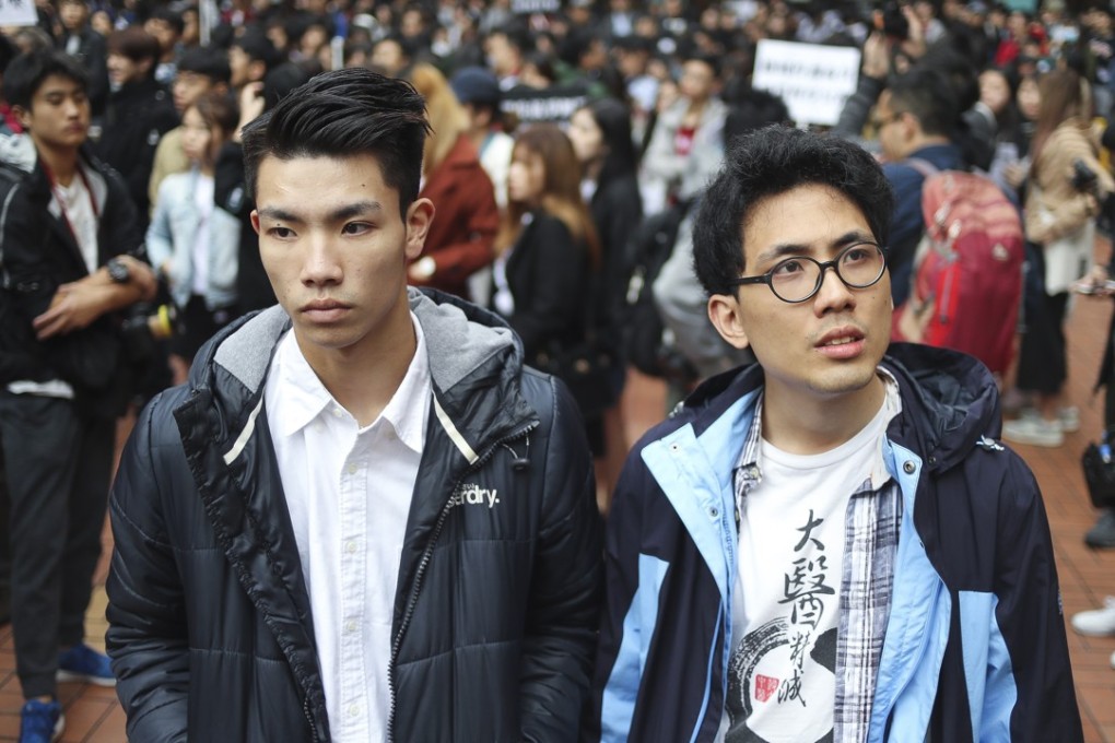 Baptist University student union president Lau Tsz-kei (left) and Chinese medicine student Andrew Chan Lok-hang at a demonstration at the university’s Jockey Club Courtyard, in Kowloon Tong on January 26. Lau and Chan were suspended for being involved in a stand-off with staff at the university’s Language Centre. Photo: Winson Wong