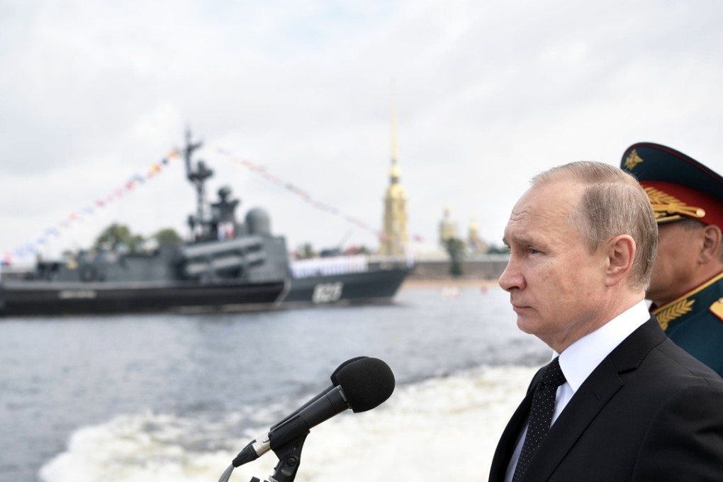 Russian President Vladimir Putin attends a ceremony for Russia's Navy Day in Saint Petersburg on July 30. The pomp-filled display of Russia's naval might celebrated the expansion of Russian sea power from the Baltic Sea to the shores of Syria. Photo: AFP