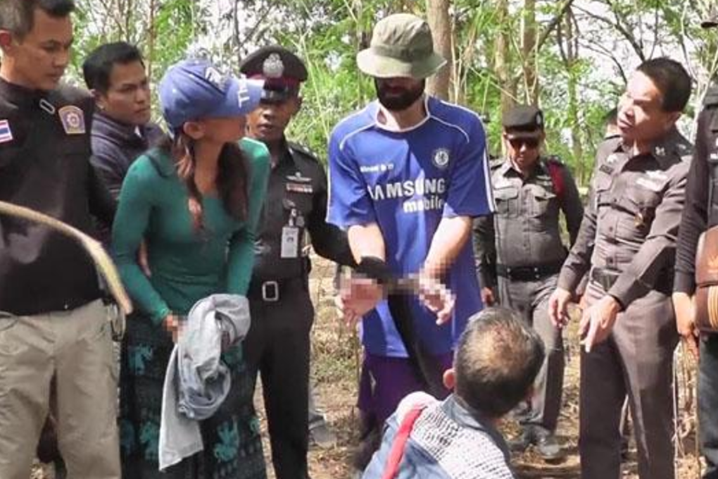 Police take Frenchman Amaury Rigaud, 34, (centre) and Rujira Iamlamai, 37, through a re-enactment of the murder of her Italian husband in Bung Na Rang district, Phichit, on Tuesday. Photo: Sitthipoj Kebui
