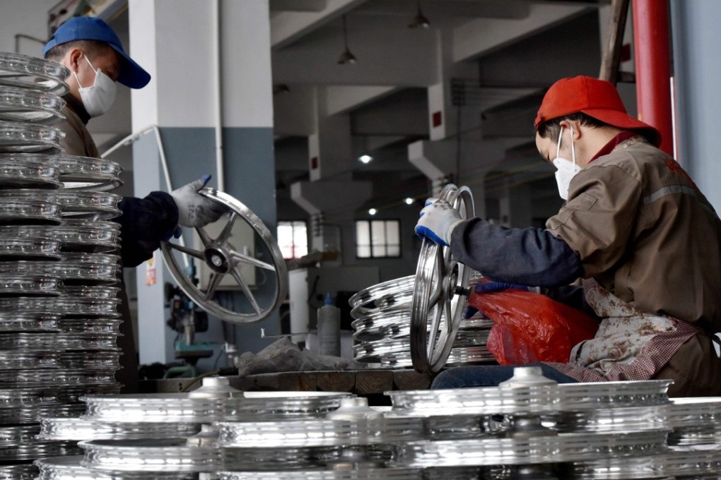 A file picture of workers at a bicycle part plant in Zhejiang province. Photo: Agence France-Presse