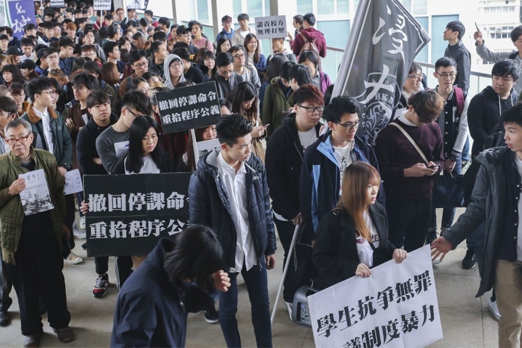 Students stage a march at the Baptist University campus in Kowloon Tong, to protest against the suspension of two of their own, on January 26. Photo: Winson Wong