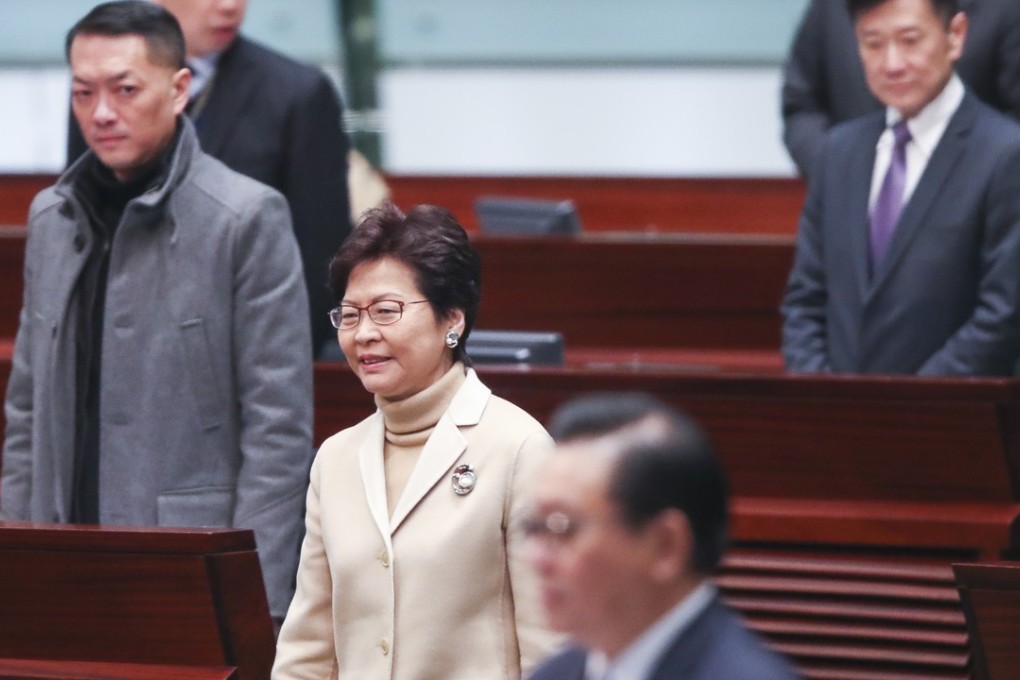 Hong Kong Chief Executive Carrie Lam (centre) attending a question-and-answer session at the Legislative Council in Tamar on Wednesday. Photo: Edward Wong