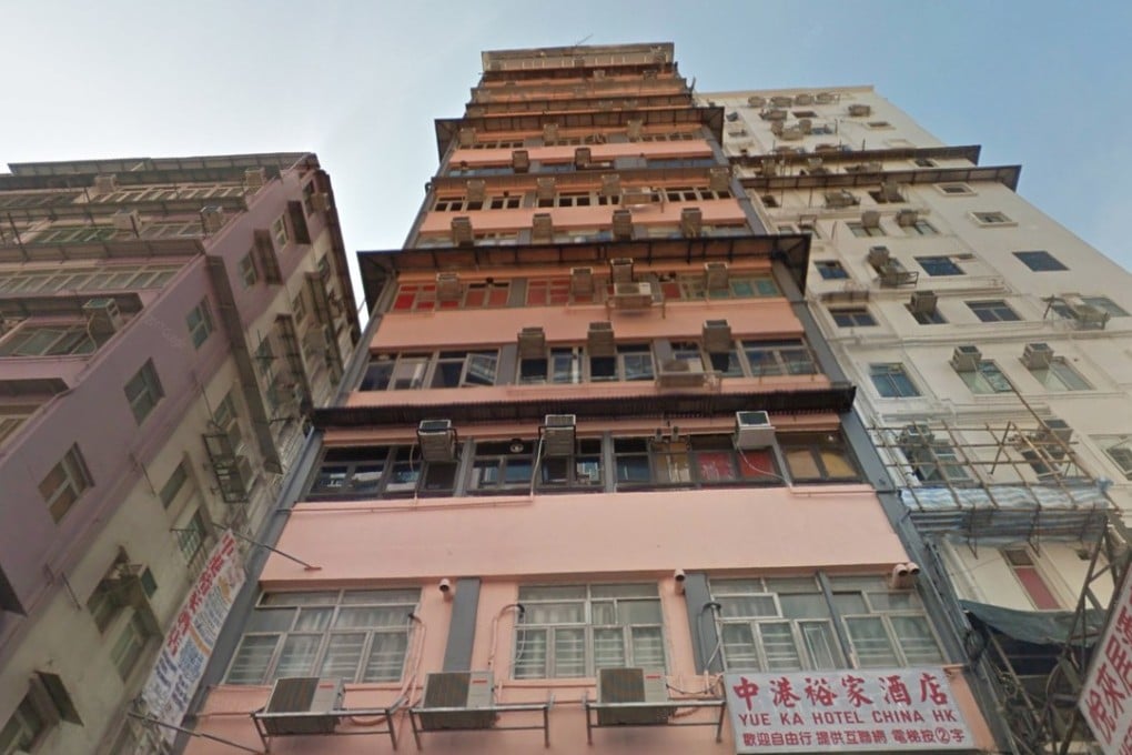 More than 60 police and immigration officers raided King Hing Building in Mong Kok on Monday. Photo: Handout