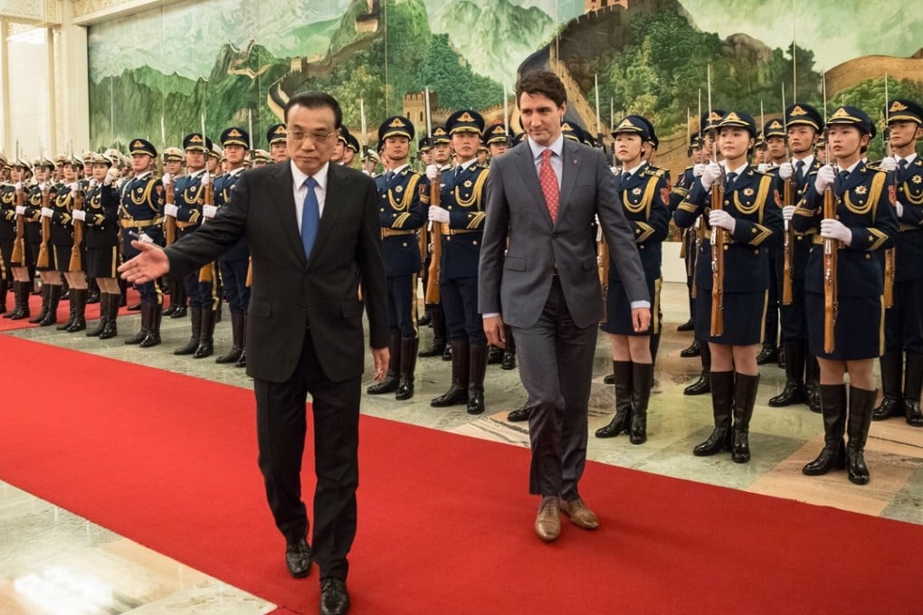 Chinese Premier Li Keqiang (left) and Canadian Prime Minister Justin Trudeau review a PLA honour guard during a welcome ceremony at the Great Hall of the People in Beijing on December 4. But Trudeau was later denied a post-meeting press conference with Li, when they failed to agree on the launch of free trade talks. Photo: EPA