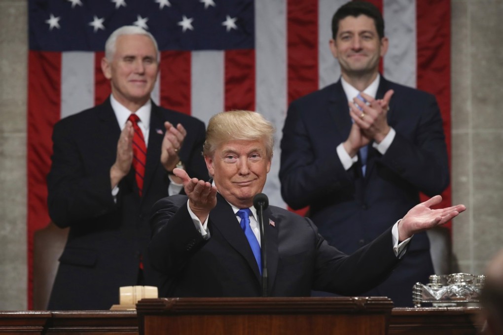 US President Donald Trump gestures as he delivers his first state-of-the-union address to a joint session of Congress on January 30, as Vice-President Mike Pence and House Speaker Paul Ryan applaud. Photo: AP