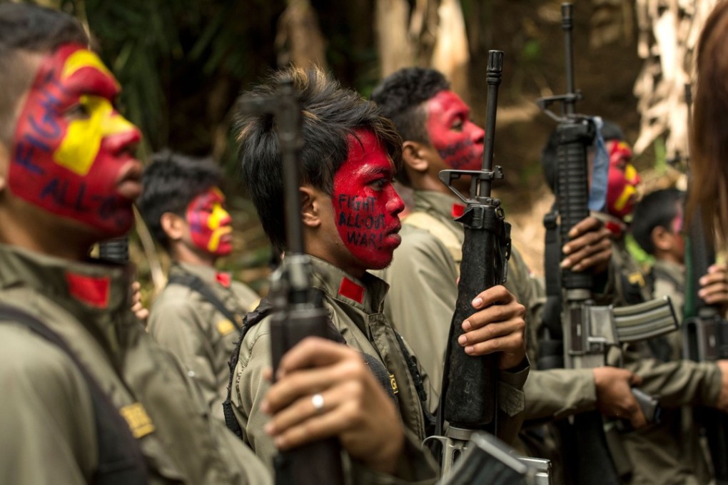 Guerillas of the New People’s Army in the Sierra Madre mountain range. Photo: AFP