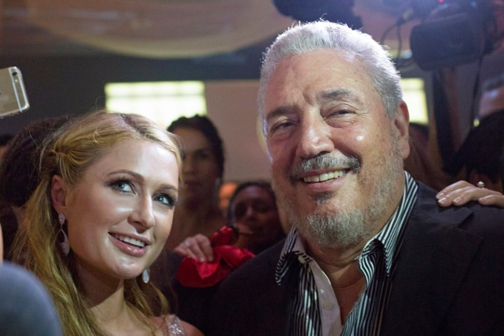 Fidel Castro Diaz-Balart, son of former Cuban leader Fidel Castro, poses with US socialite Paris Hilton as she takes a selfie during the gala dinner at the closing of the XVII Habanos Festival, in Havana, on February 27, 2015. Photo: Reuters