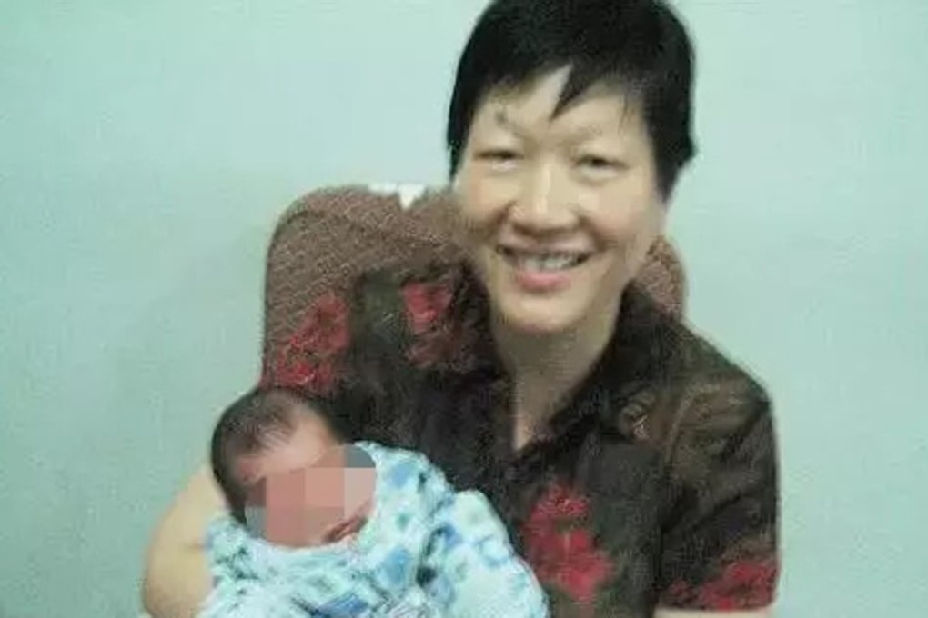 Li Guoqin pictured with one of the babies she has cared for. Photo: Weibo