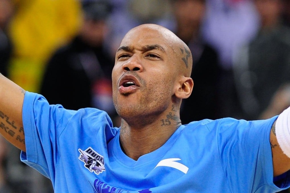 Former NBA superstar Stephon Marbury celebrates after his Beijing Ducks won their first-ever Chinese championship in Beijing. Photo: AFP