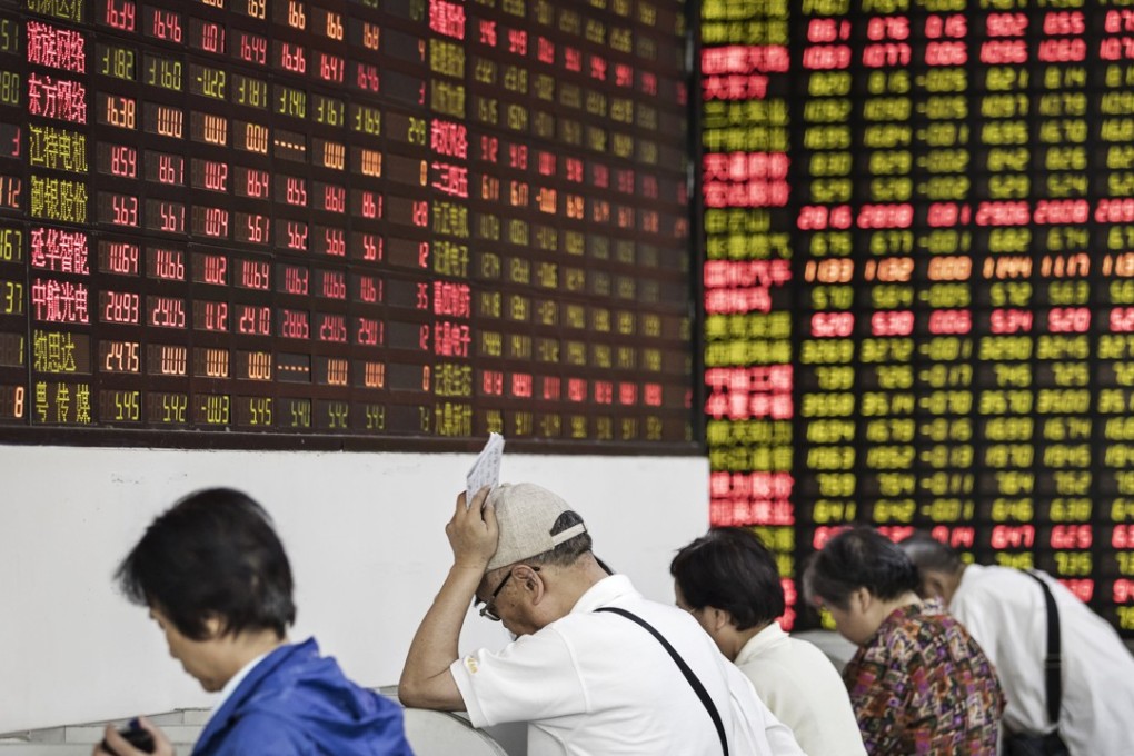 Investors at a securities brokerage in Shanghai. China is speeding up plans to allow trading on domestic bourses of overseas-listed top Chinese tech firms. Photo: Bloomberg