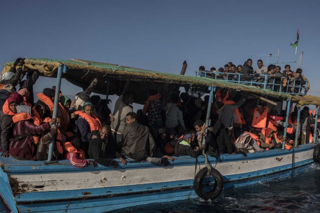 Aid workers rescued 329 refugees and migrants, mostly from Eritrea and Bangladesh, from a boat (pictured) on January 27, 2018. On Friday morning Feburary 2, 2018 some 90 people were feared to have drowned after another boat overturned off the coast of Libya. Photo: AP
