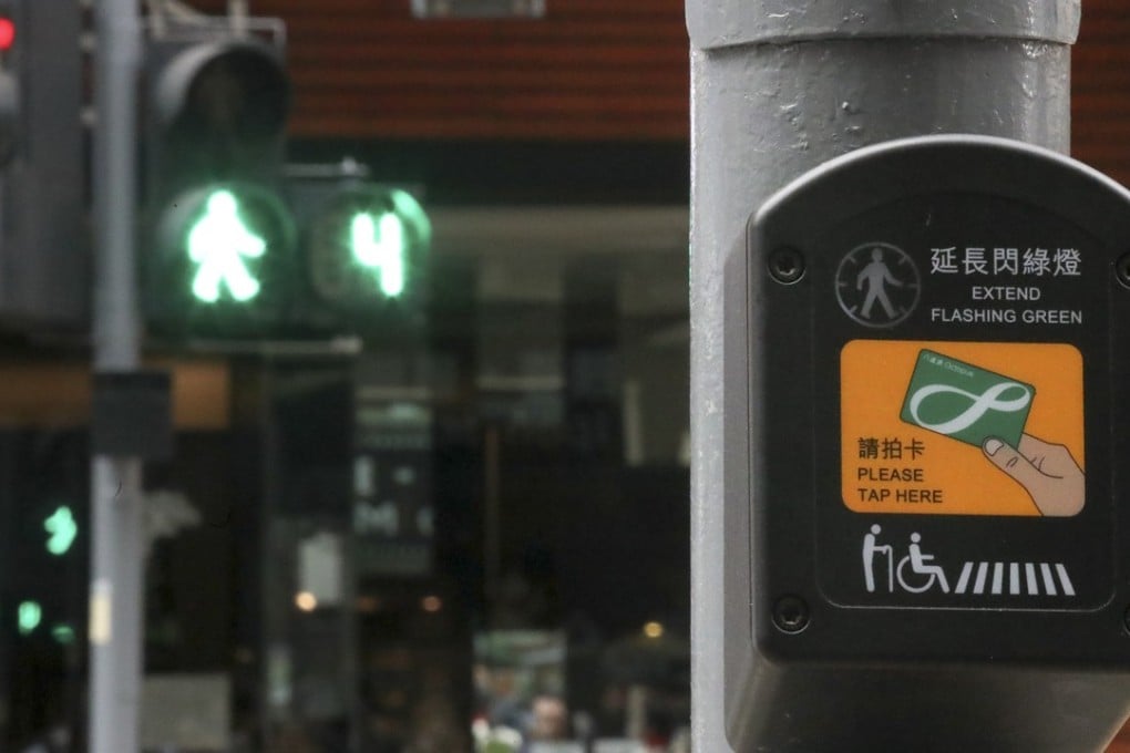 The Transport Department has rolled out a trial scheme in North Point that lengthens the time the elderly and disabled are given to cross at lights. Photo: K.Y. Cheng