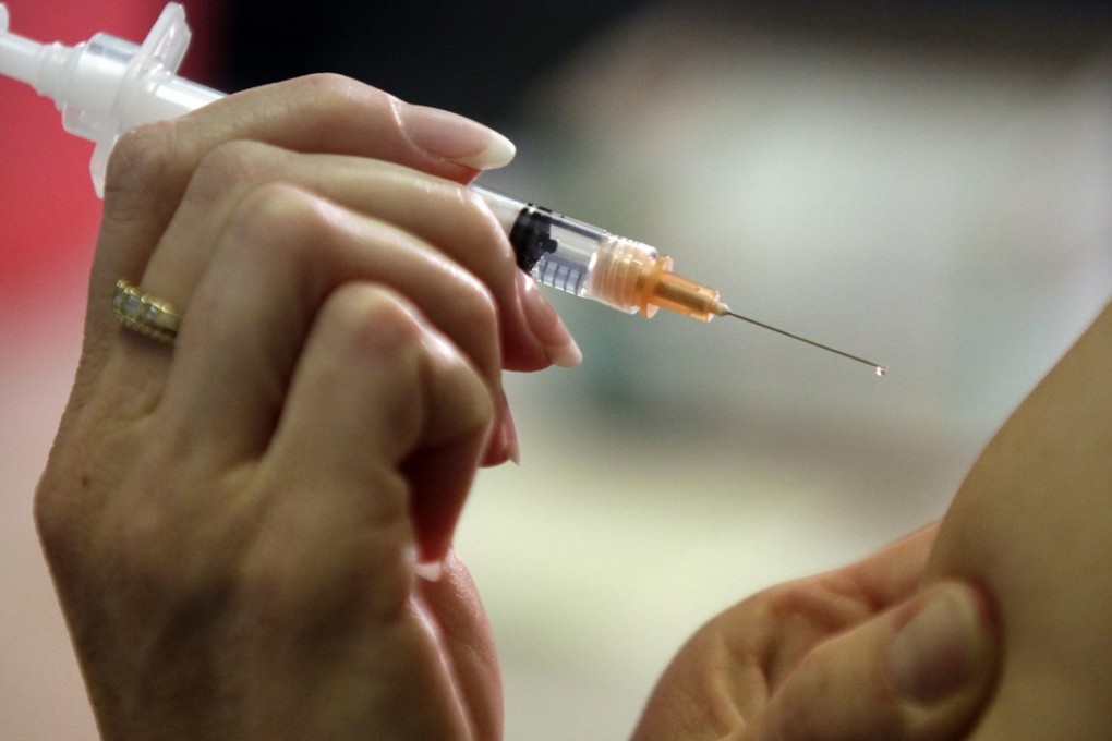‘Why are so many people unwilling to have the vaccine? One reason is that they have to receive it by injection every year,’ HKU microbiologist Yuen Kwok-yung said. Photo: AP