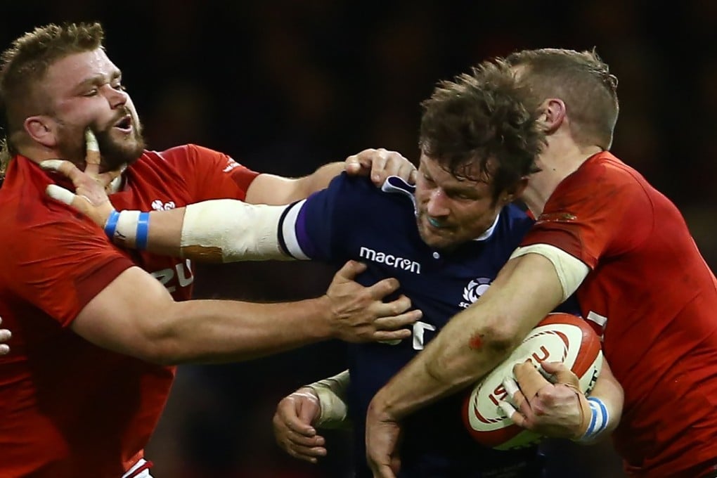 Scotland centre Pete Horne (C) is tackled by Wales’ Tomas Francis (L) and Wales’ centre Hadleigh Parkes during their opening Six Nations loss. Photo: AFP