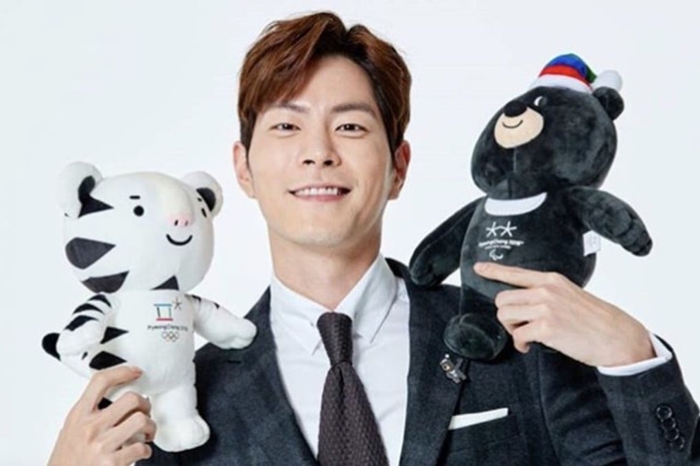 Korean actor Hong Jong-hyun with official mascots Soohorang and Bandabi, who feature on Winter Olympics-themed clothing and accessories ranging from cutely designed gloves to toques and T-shirts.