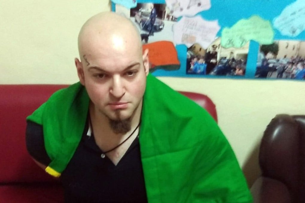 This handout picture released by the Italian Carabinieri Press Office on February 3, 2018 shows an Italian man arrested for suspected of wounding several foreign nationals in a drive-by shooting in Macerata. Photo: AFP