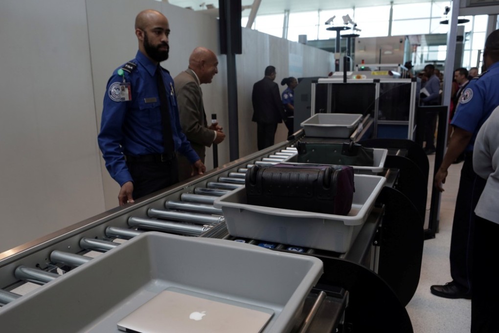 Baggage and a laptop are scanned using the Transport Security Administration's new Automated Screening Lane technology at Terminal 4 of JFK airport in New York City, U.S., May 17, 2017. Photo: REUTERS/Joe Penney
