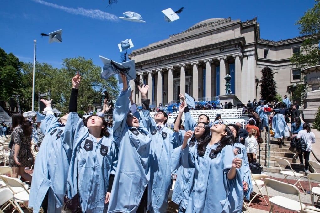 Chinese graduates throw their mortar boards into the air at Columbia University, in New York. Picture: Xinhua