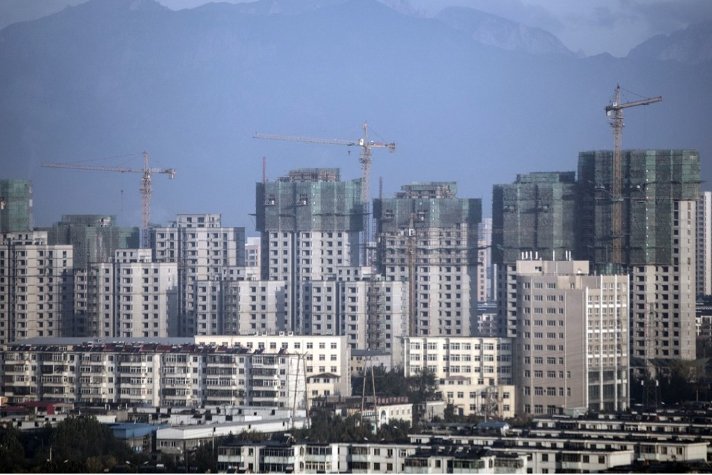 Residential buildings under construction in Qinhuangdao, Hebei province, China. Nomura sees gains in Hong Kong-listed shares of Chinese developers as their market shares increase and profitability improves. Photo: Bloomberg
