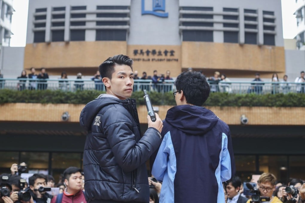 Student union president Lau Tsz-kei (left) and Chinese medicine student Andrew Chan Lok-hang at a protest against Baptist University’s decision to suspend Lau and Chan after a stand-off with staff at the language centre. Photo: Winson Wong