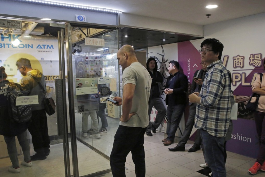 People lining up outside a bitcoin ATM in Hong Kong. Photo: AP