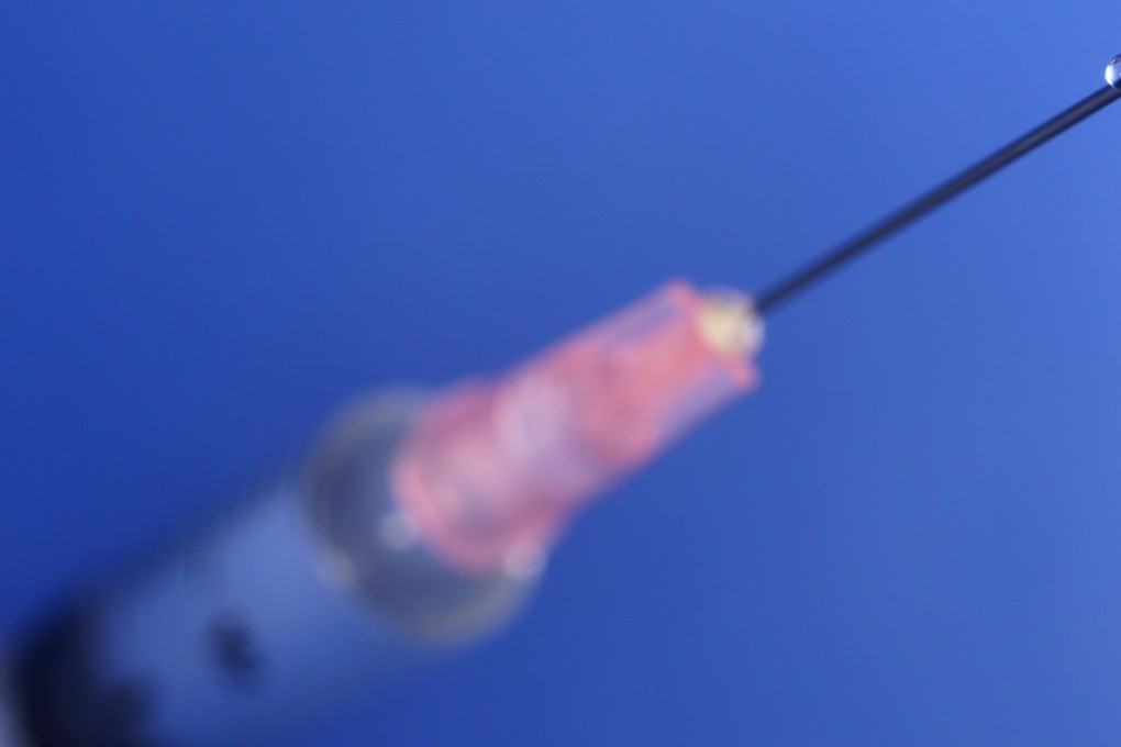 A hypodermic needle (a syringe).