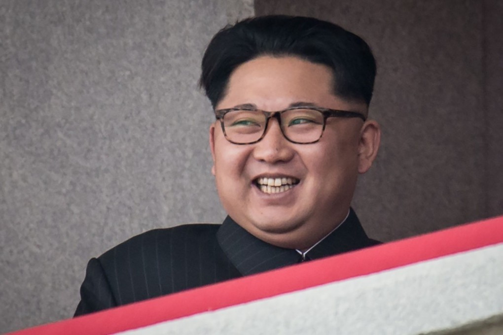 (FILES) This file photo taken on May 10, 2016 shows North Korean leader Kim Jong-Un watching a military parade and mass rally on Kim Il-Sung Square in Pyongyang. North Korea's planned military parade on the eve of the South's Winter Olympics is a carefully calculated move to use the global spotlight on the peninsula to reassert its military power, analysts say. / AFP PHOTO / Ed JONES / TO GO WITH NKorea-SKorea-politics-Oly-diplomacy,FOCUS
