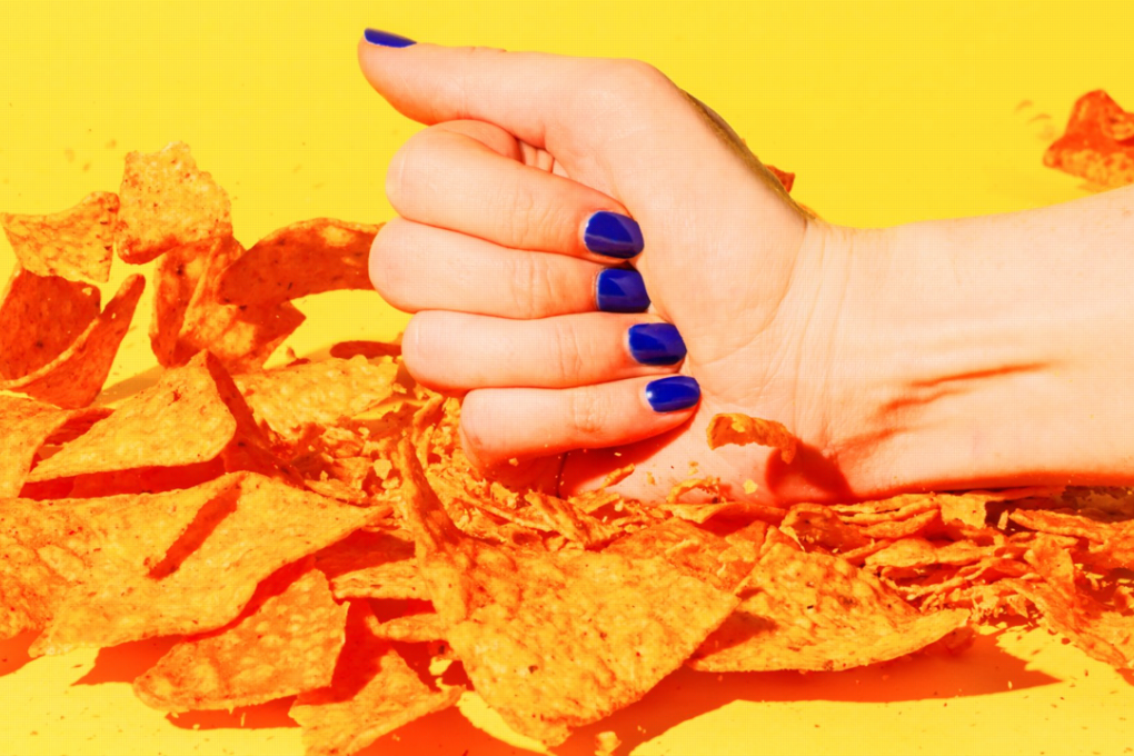 Women don't like to lick their fingers as generously as men when eating chips, PepsiCo's CEO says. Photo: Hollis Johnson