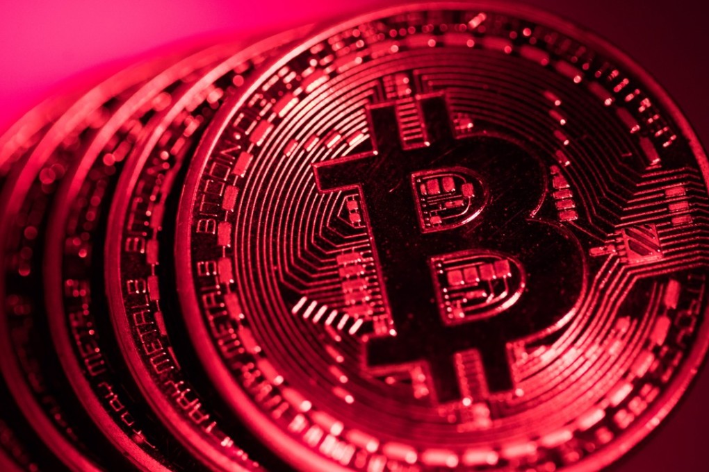 A stack of bitcoin tokens sit in this arranged photograph in London, on January 9, 2018. Russia is considering a draft law to regulate cryptocurrencies. Photo: Bloomberg