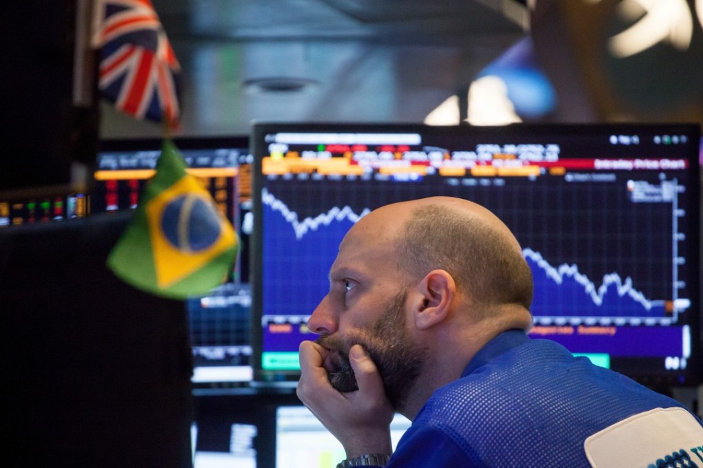 A trader nervously watches falling stock prices on the New York Stock Exchange on February 5, 2018. Photo: Bloomberg