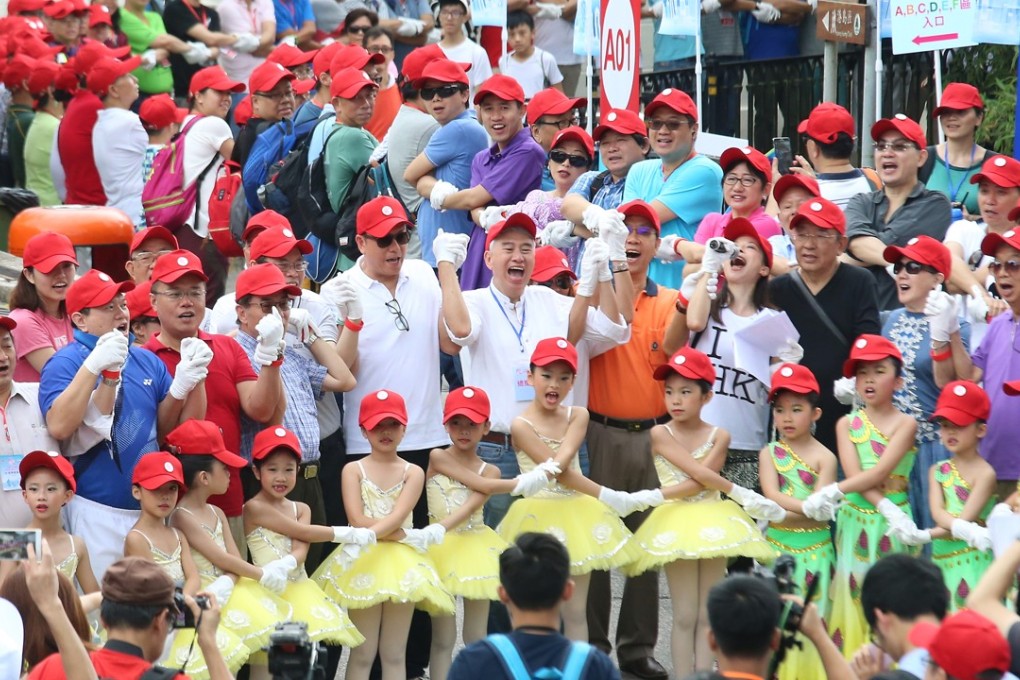 Members of the Silent Majority of Hong Kong take part in a world-record attempt to form a human chain around The Peak in July 2016. The group, founded by Robert Chow Yun, aimed to counter those involved in the Occupy protests. Photo: David Wong