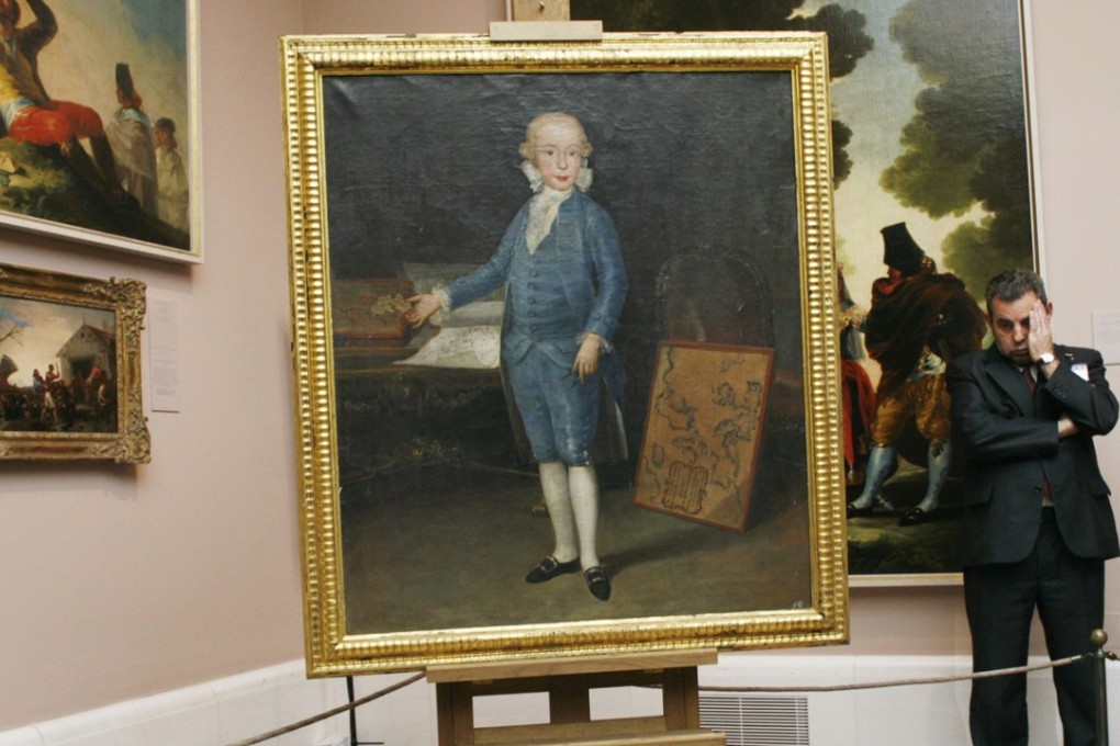 A museum employee stands next to the ‘Retrato del Infante Don Luis de Borbon y Vallabriga’ painting by Spanish painter Francisco de Goya at Madrid's Prado Museum. Photo: Reuters