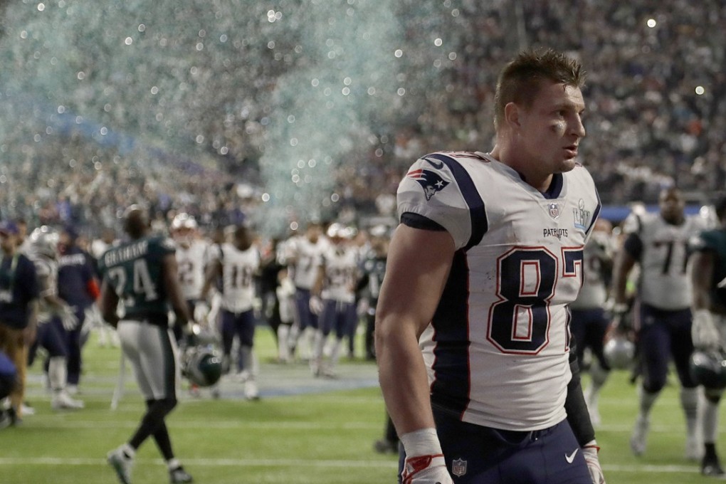 New England Patriots’ Rob Gronkowski walks off the field as the Philadelphia Eagles celebrate their Super Bowl win. Photo: AP