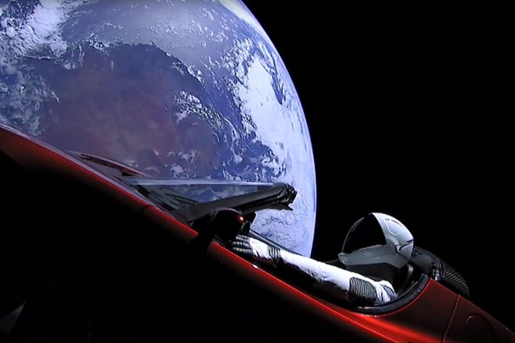 This still image taken from a SpaceX live-stream video shows Earth recede in the distance as Starman, a dummy astronaut, sits in a cherry red Tesla roadster after the Falcon Heavy rocket delivered it into space on Tuesday. Photo: Agence France-Presse