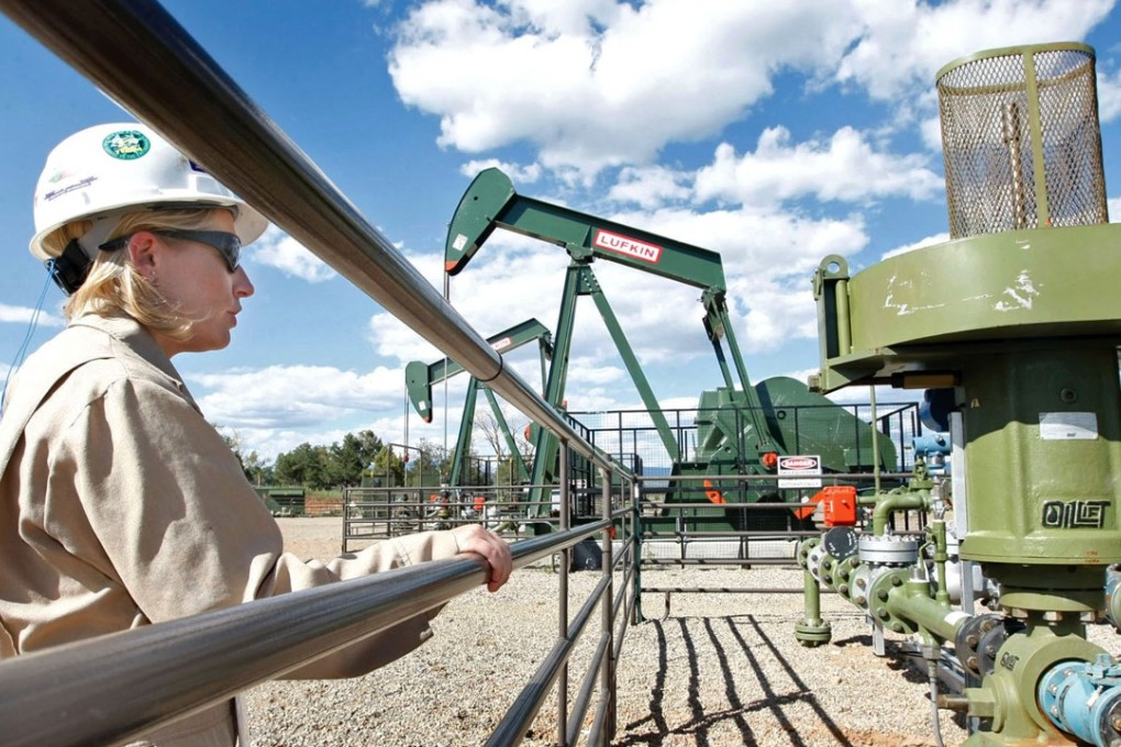 A BP Florida operations manager looks over a methane gas well site, east of Bayfield, Colorado. Reducing or eliminating methane is an under-discussed method for reducing global greenhouse gas emissions and mitigating the effects of climate change. Photo: AP