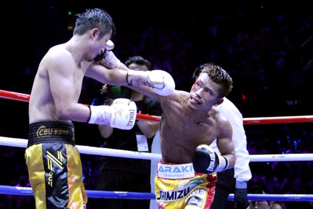 Sho Kimura throws a right hand against China’s Zou Shiming during their WBO flyweight title fight in Shanghai. Photo: Sho Kimura/Facebook