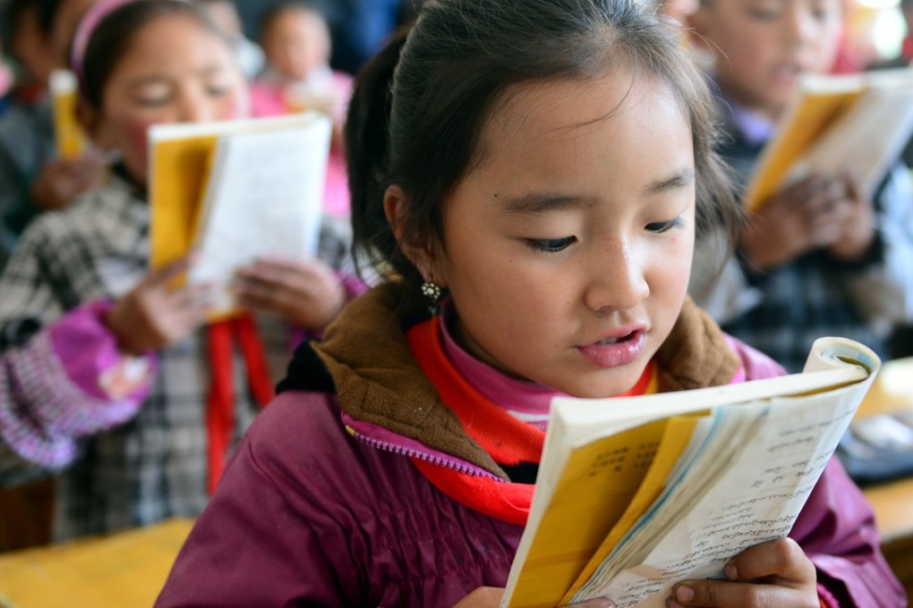 A pupil recites an article in the Tibetan language at a junior school in Xiahe county of Gansu province, in northwest China, home of the great Labrang monastery. The school holds classes in both Tibetan and Han languages for its more than 600 students. Photo: Xinhua