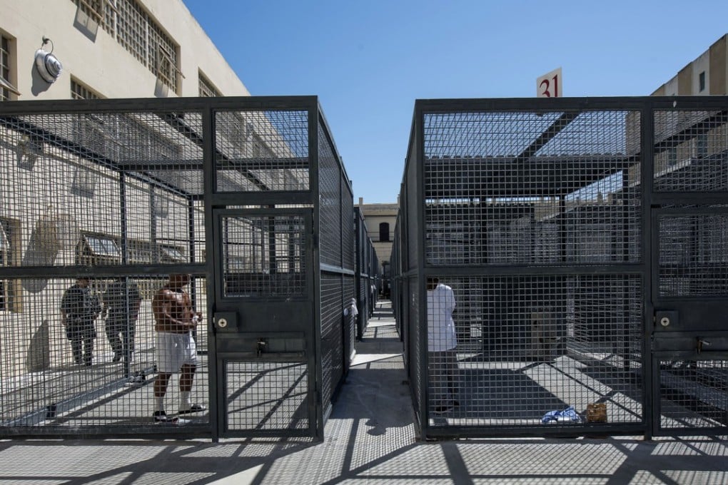 Inmates exercise in cages at San Quentin State Prison in San Quentin, California. Photo: Bloomberg