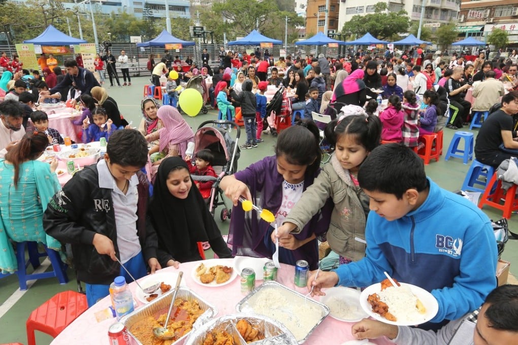 Some 1,200 low-income workers, including ethnic minority families, attend a poon choi feast. Photo: Dickson Lee