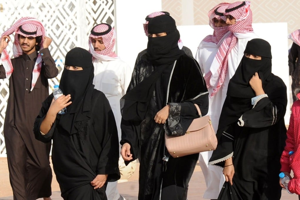 A picture taken on January 19 shows Saudi women and men during the King Abdulaziz Camel Festival in Rumah, some 160km east of Riyadh. Photo: AFP