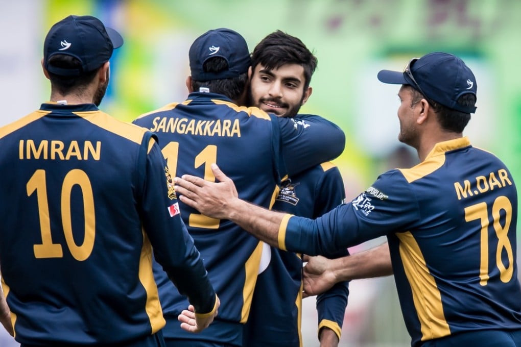 Haroon Arshad is hugged by captain Kumar Sangakkara after helping his team to victory. Photo: Ike Li / Ike Images
