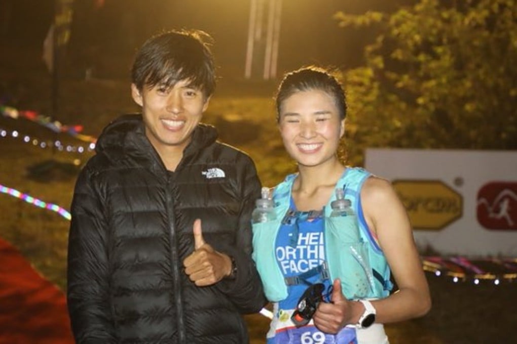 Qi Min and Yao Miao at the finish line of the HK100. Photo: Twitter/@iRunFar