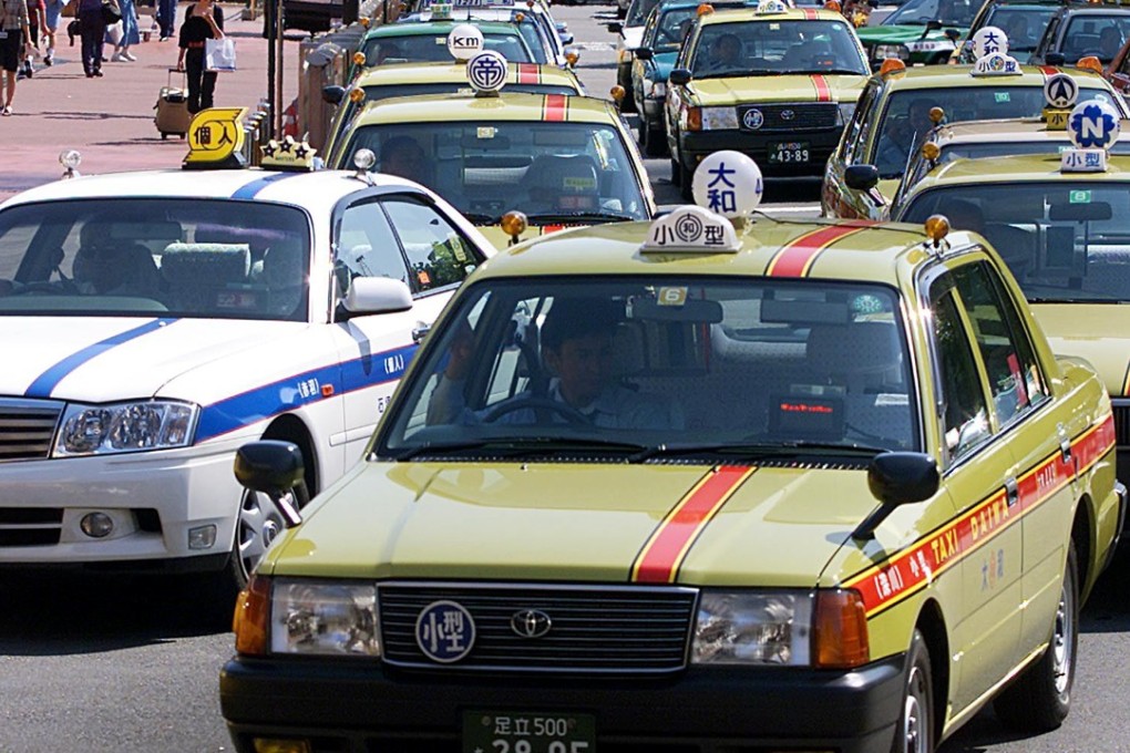 Taxis queuing for customers in central Tokyo.