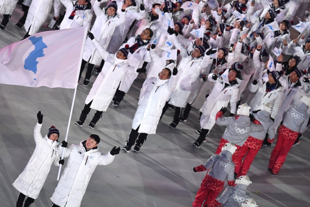 Shortly after the Unified inter-Korean team and flag bearers Carrived during the opening ceremony of the Pyeongchang Winter Olympic Games on Friday, an unknown Korean man rushed the group. He was escorted from the building by security. Photo: EPA-EFE
